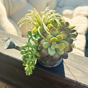 Unique faux succulent arrangement in small watering can